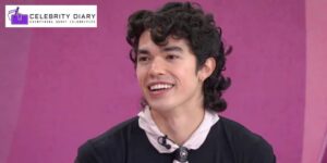 Conan Gray smiling during an interview about his song ‘Wishbone’ and his favorite hairstyle